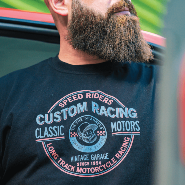 Close up image of the Classic Motors Tee in Black Custom Racing logo. On the Spanners, UK